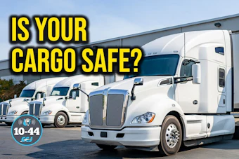 Fleet of white commercial trucks with yellow text asking 'Is Your Cargo Safe?' and cargo safety rating badge