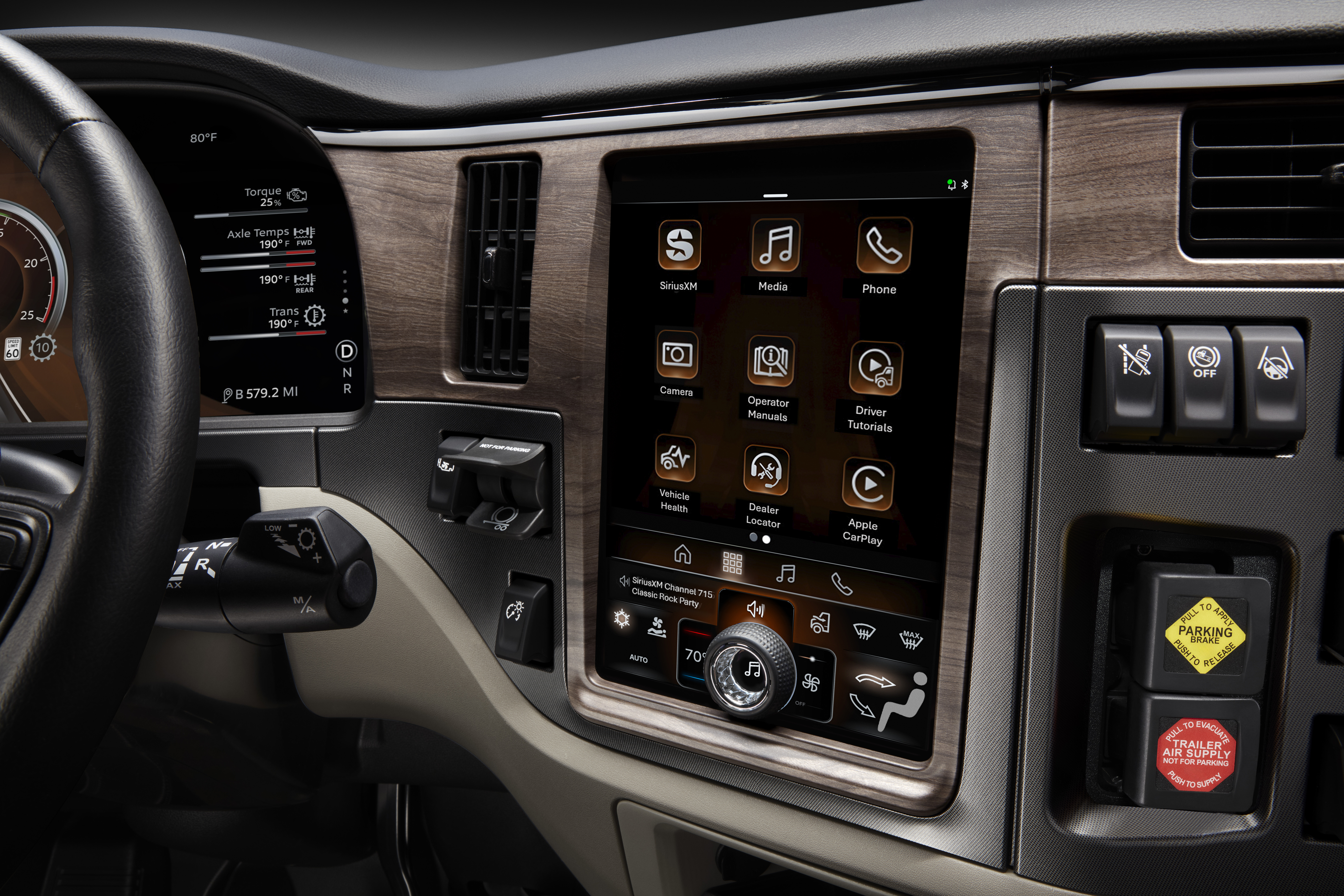 Vehicle dashboard with touchscreen infotainment system displaying apps and controls