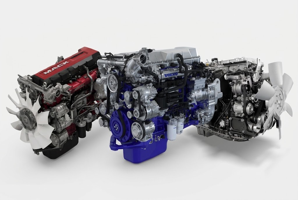 Collection of Volvo diesel and gasoline engines displayed in various configurations with red, blue, and silver finishes