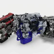 Collection of Volvo diesel and gasoline engines displayed in various configurations with red, blue, and silver finishes